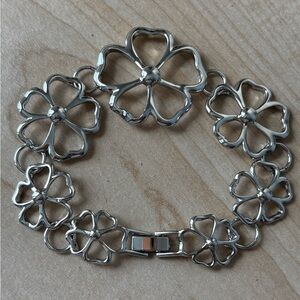 Lia Sophia flower bracelet/silver tone/ fold over clasp/ comes with orig…